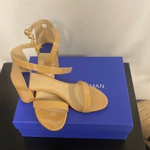 STUART WEITZMAN NEARLY NUDE ADOBE PATENT SANDAL